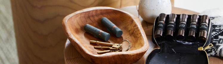 coco lips balms placed with keys and diffuser blends