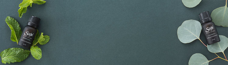 Saje Diffuser blend placed with greenery