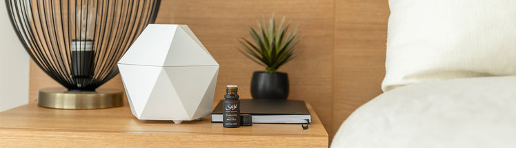 Aroma Be Free cordless diffuser on a wooden nightstand
