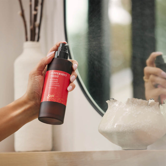 Person spraying peppermint twist room spray