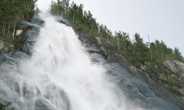 A misty waterfall in the forest. 