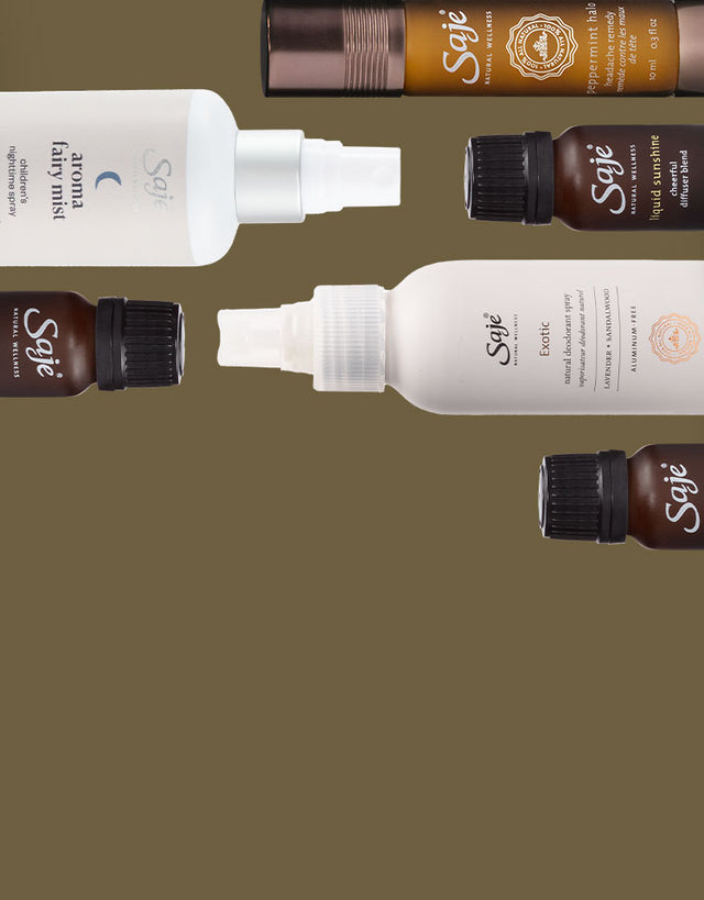 Different 100% natural Saje products stack next to each other on a khaki-coloured background.
