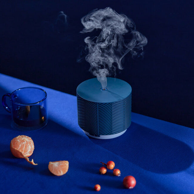 Denim Aroma Nook ultrasonic diffuser with oranges and berries diffusing essential oil