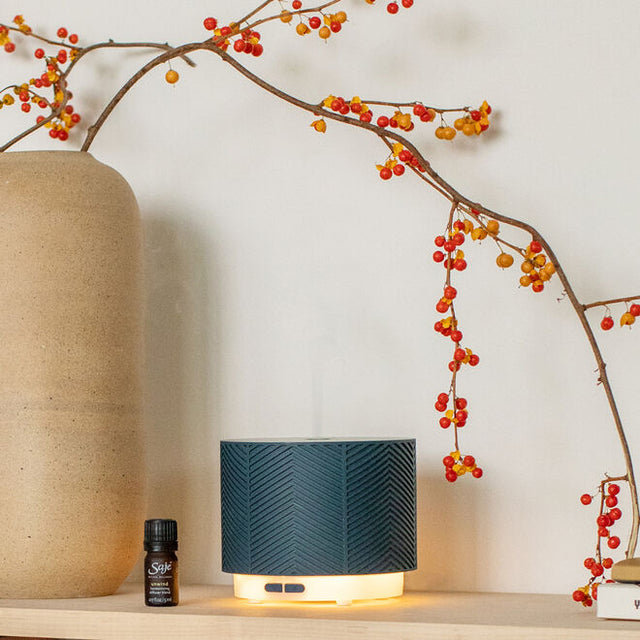Denim Aroma Nook ultrasonic diffuser with diffuser blend styled on table