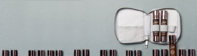 Essential oil roll-ons shown in a portable travel case