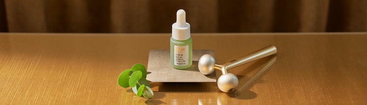 Saje face oil placed with spearmint