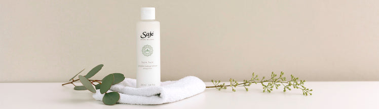 Saje bareface makeup remove placed with eucalyptus and a towel