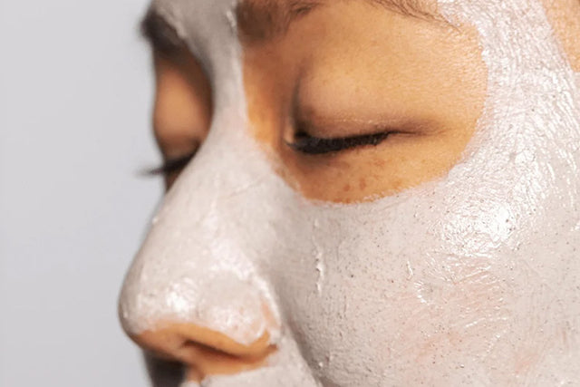 woman with a face mask against a white background