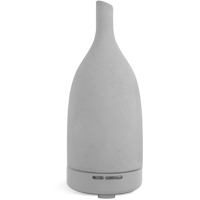 A grey Saje Aroma Om diffuser.