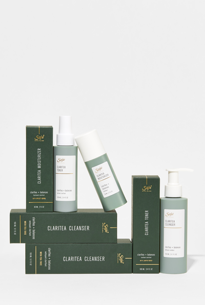 A Saje Claritea skincare collection featuring a cleanser, toner and moisturizer.