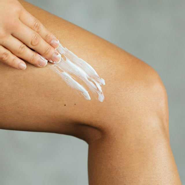 A person applying Tantra Sensuous coconut and shea body butter to their leg