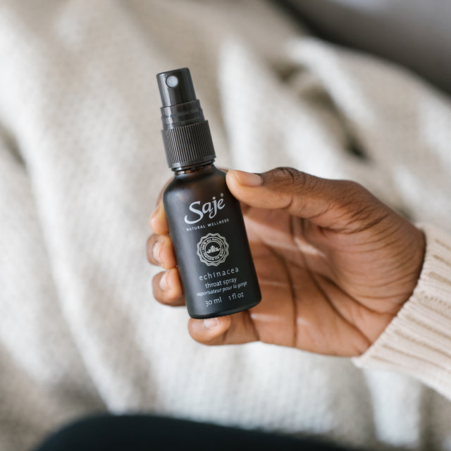A person holding Echinacea herbal throat spray 30ml 
